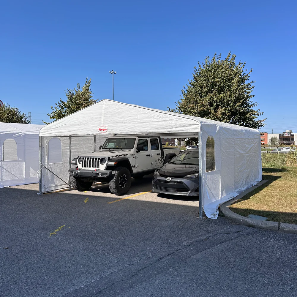 Side view of double tempo shelter with two cars underneath